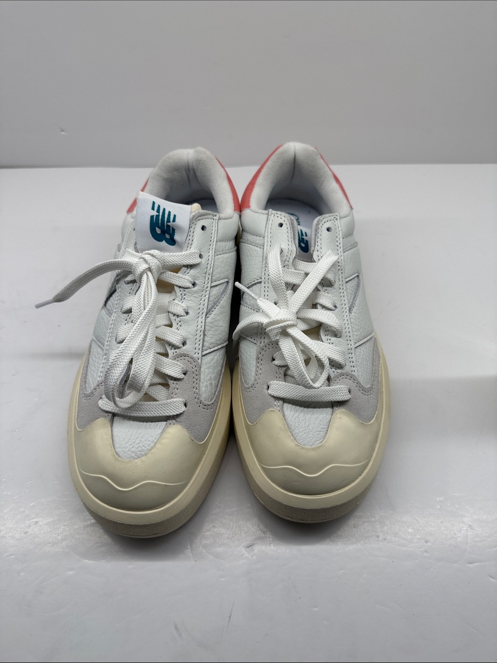 New Balance White Sneakers with Cream Toe and Pink Heel Accents